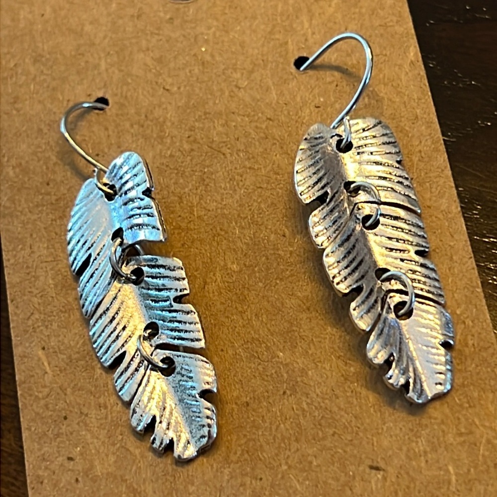 Silver tone feather earrings-NWT